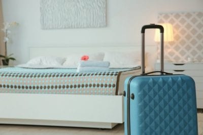 House Cleaner Won't Leave Airbnb, Suitcase in Bedroom