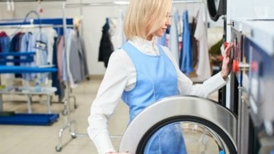 Mid-Stay Cleans cleaning service worker using washing machine