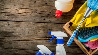 Mid-Stay Cleans cleaning supplies on wooden table
