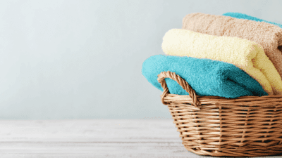 Broken Appliances bath towels in basket isolated