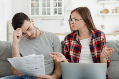 Can't Afford Insurance, Couple Discussing Bills